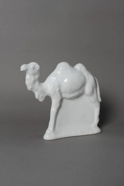 Camel. Small, white glazed figure.