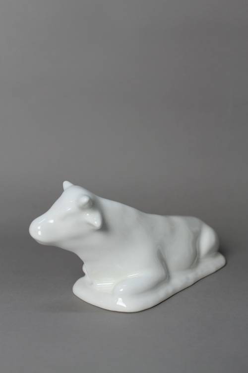 Ox. Small, white glazed figure.