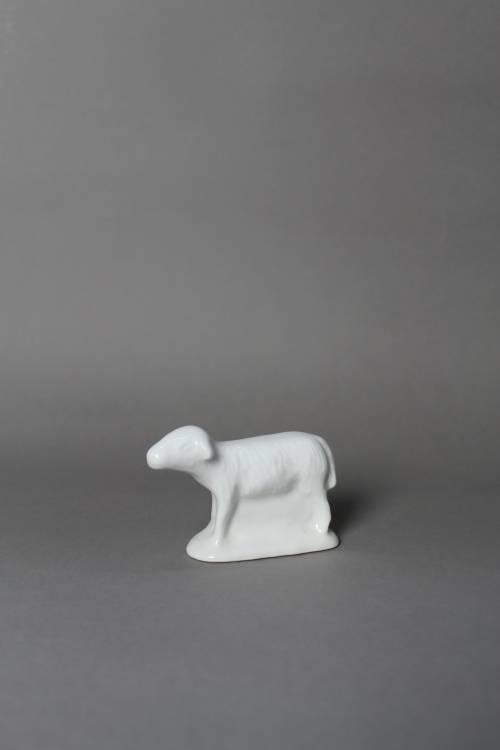 Sheep. Small, white glazed figure.